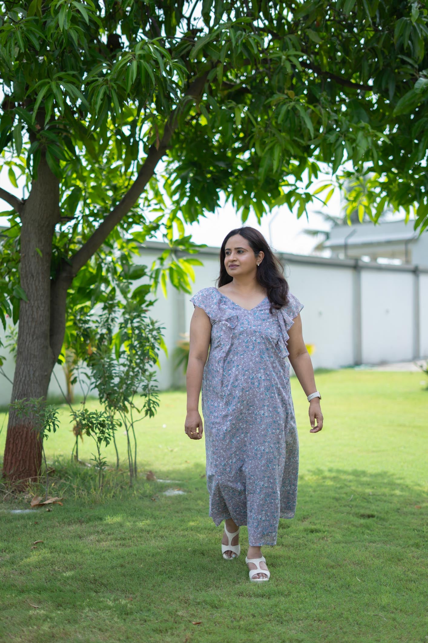 Model wearing Lilacline Maxi Dress size M, with floral print and frills. Available in plus size.