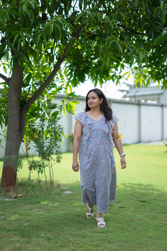 Model wearing Lilacline Maxi Dress size M, with floral print and frills. Available in plus size.