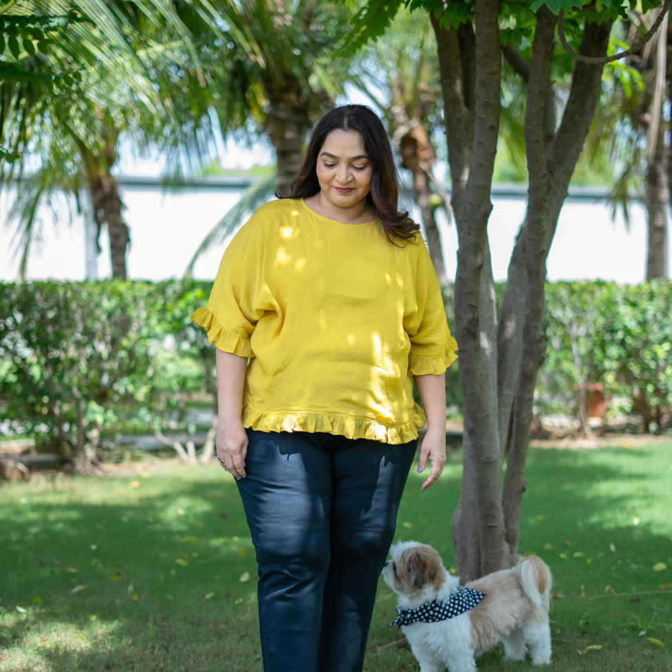 Model wearing Mustard Yellow top, size 3XL